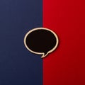 Round empty chalkboard wooden speech bubble on red and dark blue Royalty Free Stock Photo