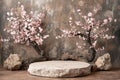 Round empty stone podium display with beautiful pink flower background for product showcase Royalty Free Stock Photo