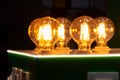 Round energy efficient light bulbs in a glass bulb with warm light