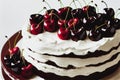 Round festive fruit cake with white cream and decoration of fresh berries