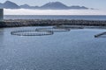 Round fish farm at Melbu harbor, Norway