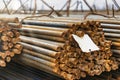 Round fittings in packs are stored in the warehouse of the steel products plant. Round metal rods for the modern production of Royalty Free Stock Photo