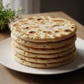 Of round, flat breads, resembling flatbread or pita, sits on a Royalty Free Stock Photo