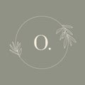 Round Floral frame with the Letter O. Wedding Monogram and Logo with Olive Branch in Modern Minimal Liner Style. Vector Royalty Free Stock Photo