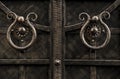 Round forged door handles on a metal gate Royalty Free Stock Photo