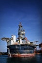 Round FPSO berthing at port with blue sky Royalty Free Stock Photo