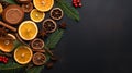 a round frame made of winter things like pine branches, cinnamon sticks, and dried orange slices on a dark blackboard