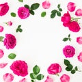 Round frame of pink ranunculus flowers, roses and leaves on white background. Floral lifestyle composition. Flat lay, top view Royalty Free Stock Photo