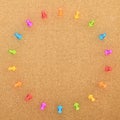 Round frame of pins over cork board Royalty Free Stock Photo