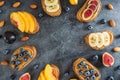 Round frame of sandwich with peanut butter, fresh fruits and berries. Healthy breakfast concept. Flat lay, top view Royalty Free Stock Photo