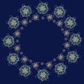 Round frame or wreath made of handmade paper snowflakes in quill