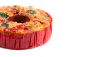 A Round Fruit Cake with Cherries Pineapples and Nuts on a White Background Royalty Free Stock Photo