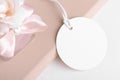 Round gift tag mockup with beige wedding favor on a white background, Wedding favor tag for souvenir