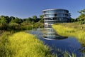 Round glass house on the lake in the Netherlands