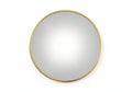 Round gold framed mirror on white background interior decor Royalty Free Stock Photo