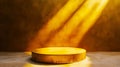 A round gold pedestal in front of a yellow wall Royalty Free Stock Photo