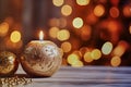 Round golden burning candle on a wooden board against a blurred background with bokeh circles, selective focus, banner, background