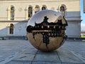 Round golden earth sphere mechanic at Trinity College I'm Dublin Ireland