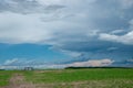 Round Grain Bins in a Canola Field, Saskatchewan, Canada. Royalty Free Stock Photo