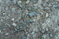 Round granite stones on the ground with sand Royalty Free Stock Photo