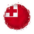 Round grunge flag of Tonga with splashes in flag color Royalty Free Stock Photo