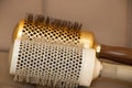 Round hair comb in beauty salon close-up