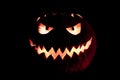 Round halloween pumpkin smile with hot burning fire eyes mouth
