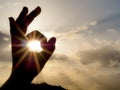 Round hand sign Ok with sunny background