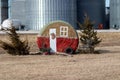 Round hay bail painted for the Christmas In Nebraska Royalty Free Stock Photo