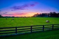 Round Hay Bails in a Field With Fence Royalty Free Stock Photo