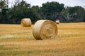 Round Hay Bales on Farmer`s Field on Prairie Royalty Free Stock Photo