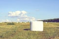 Round hay bales in plastic wrap cover Royalty Free Stock Photo