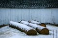 Round Hay Bales by White Barn Royalty Free Stock Photo