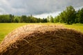 Round Haybale with Storm Approaching Royalty Free Stock Photo