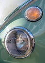 Round headlights of an old vintage retro car of pastel color Royalty Free Stock Photo