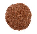 Round heap of dried flax seeds isolated on white background, top view, close up