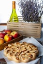 Round homemade pie with apples on a wooden table. . Simple pastry made from shortcrust pastry and caramelized apple. Sweet Royalty Free Stock Photo