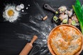 Round homemade pie with crab meat on a black wooden background in a beautiful composition. top view. Space. Close-up Royalty Free Stock Photo