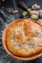 Round homemade pie with crab meat on a black wooden background in a beautiful composition. top view. Space. Close-up Royalty Free Stock Photo
