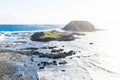 Round island surrounded by water at the Nobbies at Phillip Island, Victoria, Australia Royalty Free Stock Photo