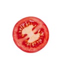 Round juicy slice of tomato for the preparation of various dishes and burgers. Isolated.