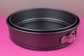 Round kitchen baking dish on background for cakes Royalty Free Stock Photo