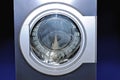 Round loading hatch of the industrial washing machine Royalty Free Stock Photo