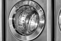 Round loading hatch of the industrial washing machine Royalty Free Stock Photo