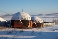 Round lodges for rest on the shore of the Large Lake, in the village.