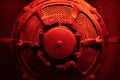 Round machine or bunker door with red and dramatic lighting