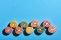 Round marmalade candies on a blue background