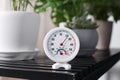 Round mechanical hygrometer on black table indoors Royalty Free Stock Photo