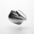Round metal candle tin with lid floating on solid white background Royalty Free Stock Photo