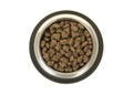 Round metal feeding bowl with heart shaped pet kibble seen from